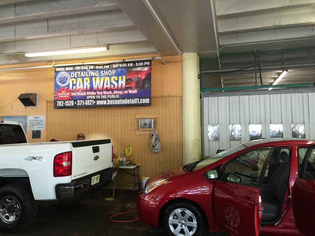 The Bo's Auto Detailing bay inside Mark's Garage, with the blue "Detailing Shop Car Wash" banner above the work area